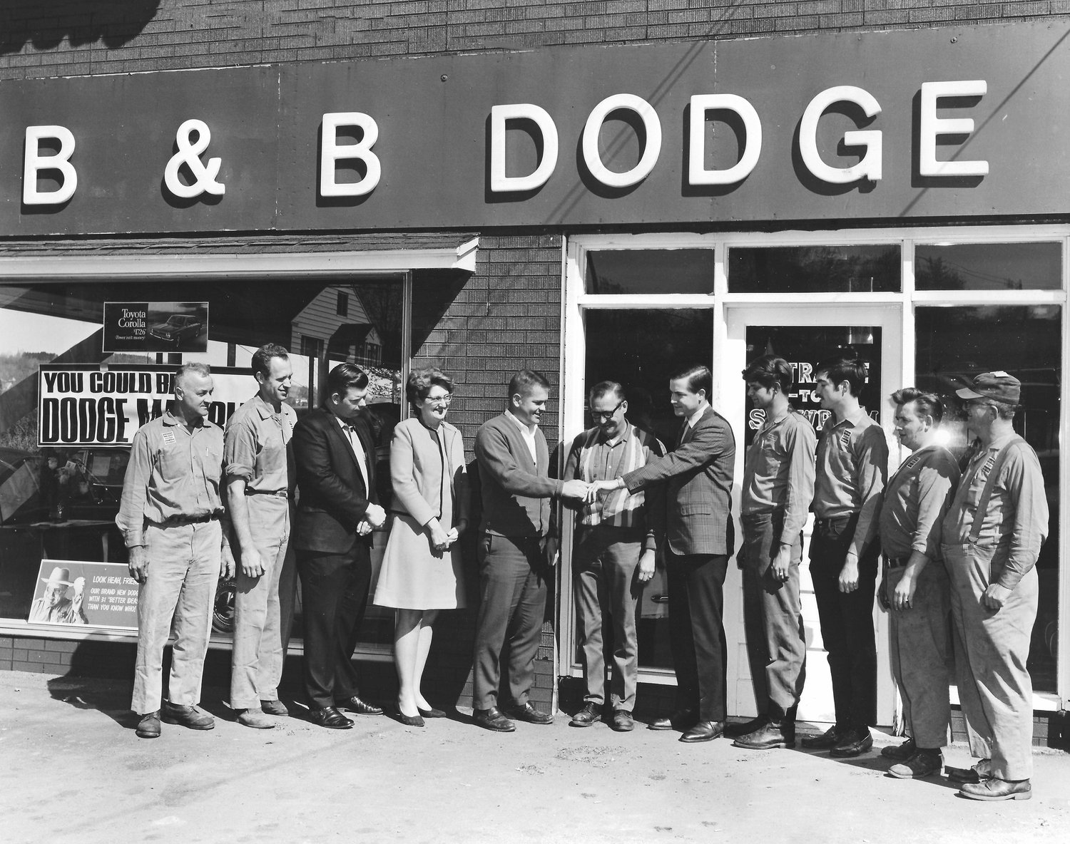 On April 26, 1970, surrounded by their employees, three brothers from Honesdale opened B&;B Dodge. Pictured are Wes Weber, left, Bill Tennant, Gary Peck, Agnes Weidner, Bob..Carmody, Bob McKinnell, John Carmody, Dennis Jennings, Steve Carmody, Art Meyer and Charlie Schaff.